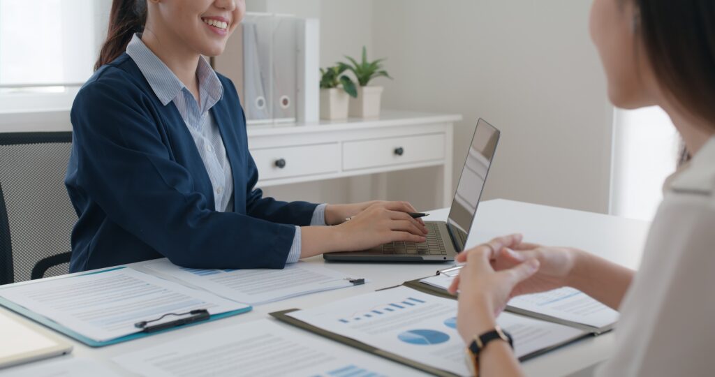 Asia real estate sale agent, stock market trader woman work at bank office